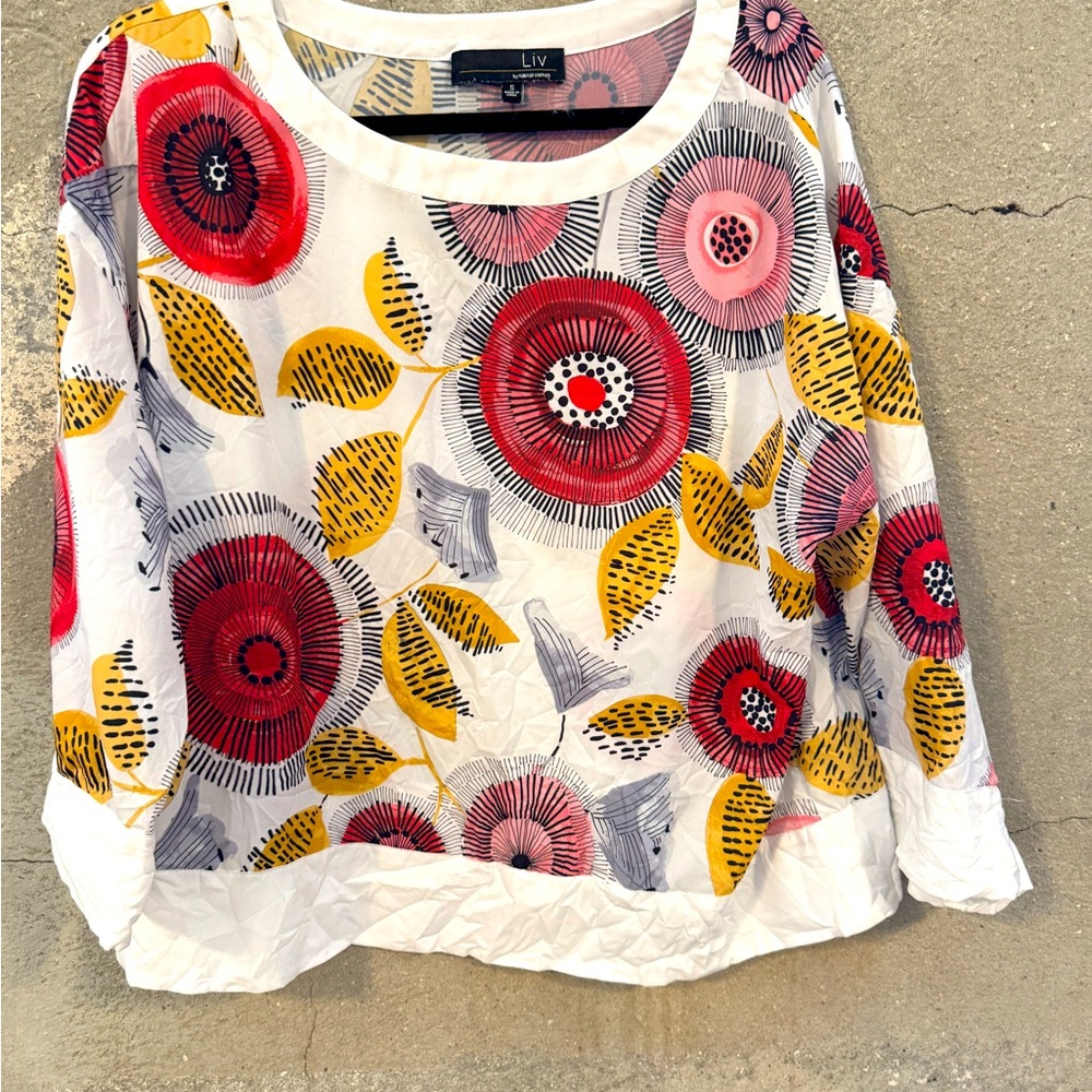 Pull over top great for layering. 100% polyester.